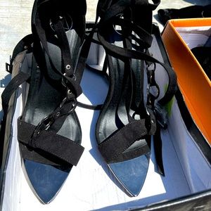 Brand new in box strapped heels.